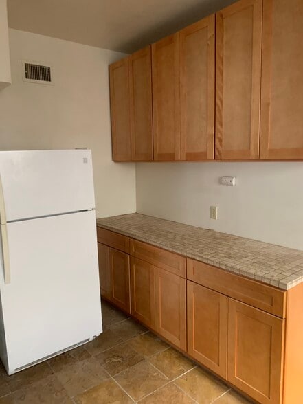 Remodeled Kitchen Cabinets/Stone Tile - 822 S Curson Ave