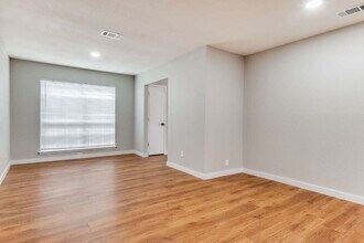 Building Photo - Light-Filled 3BR Brick Home featuring Granite Kitchen & Dual Living Spaces