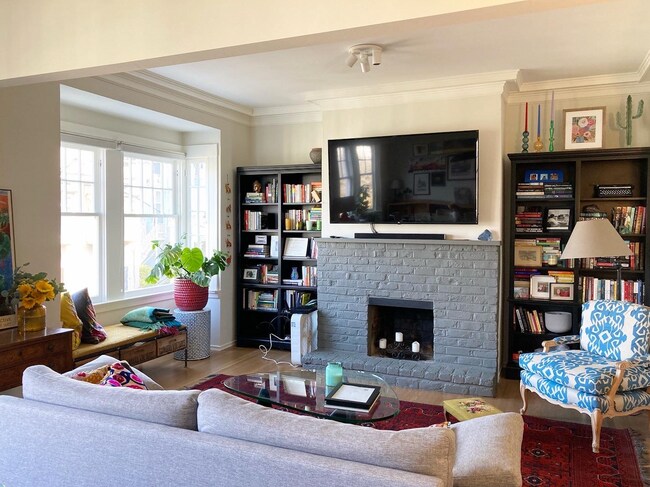Fireplace, built in bookcases, and reading nook. - 37 Alma St