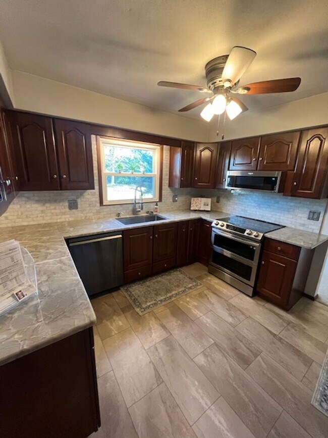 Building Photo - Spacious, Fully Updated Home with Walkout Basement on a Mature Lot