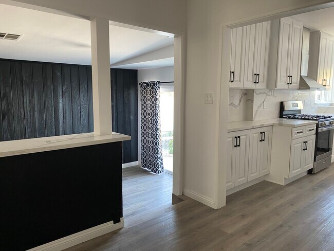 Step down into den w/fireplace - 17423 Burbank Blvd