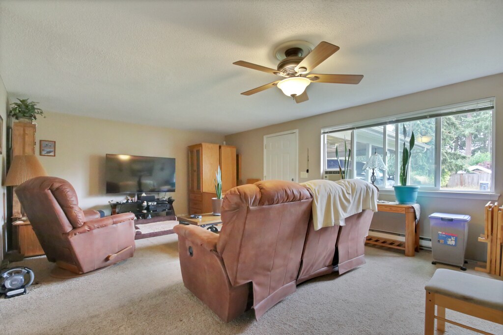 Living room looking toward entry and front window. - 7017 Sacramento St SW
