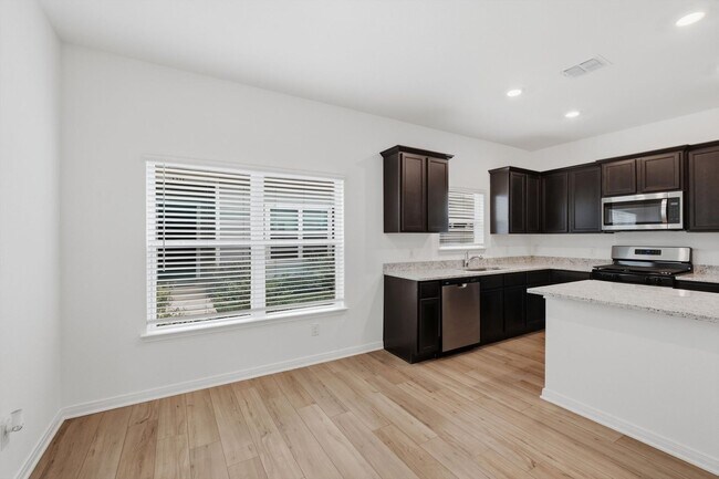 Building Photo - Clean & Modern Townhome with No Carpet and Lawn Service Included