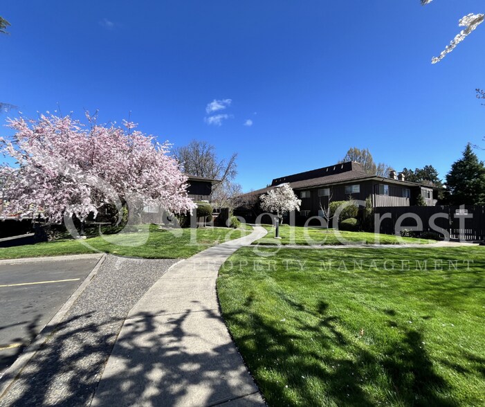 Building Photo - Convenient 2 Bedroom 2 Bathroom Condo Living "In The Trees" with On-Site Amenities