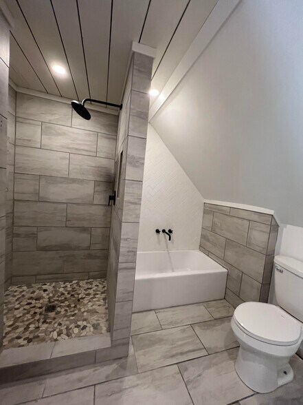 We have a large shower in the master bedroom with a rainfall shower. - 624 Park St