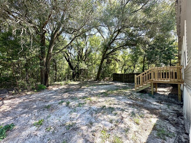 Building Photo - Privacy and Space in this 3/2 Home at the ...