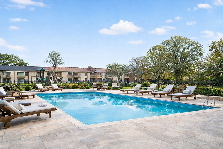 Tranquil poolside in a scenic community - Pembroke Lake Apartments