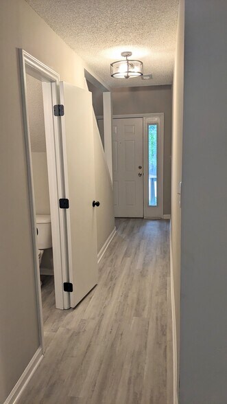 Entry way hallway and half bath - 4113 Arckelton Dr