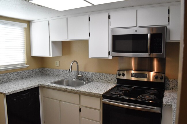 Building Photo - Condo unit featuring updated kitchen with ...