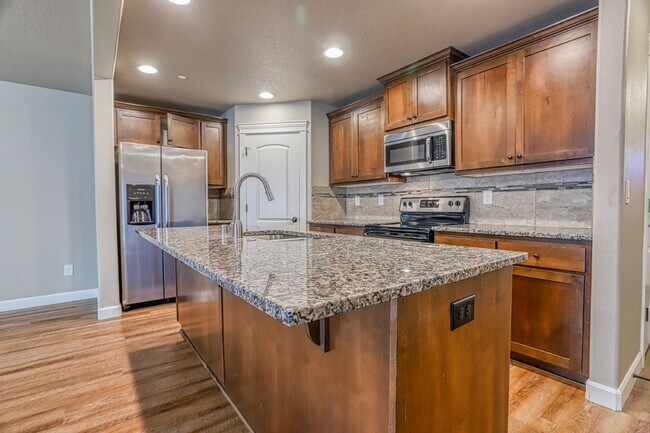 Building Photo - Centrally Located 4 Bedroom Townhome with Attached Garage & AC