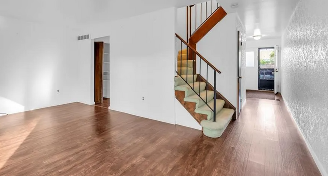 Dining hall connecting to the kitchen and stairs leading to the bedrooms - 2134 Wickham St