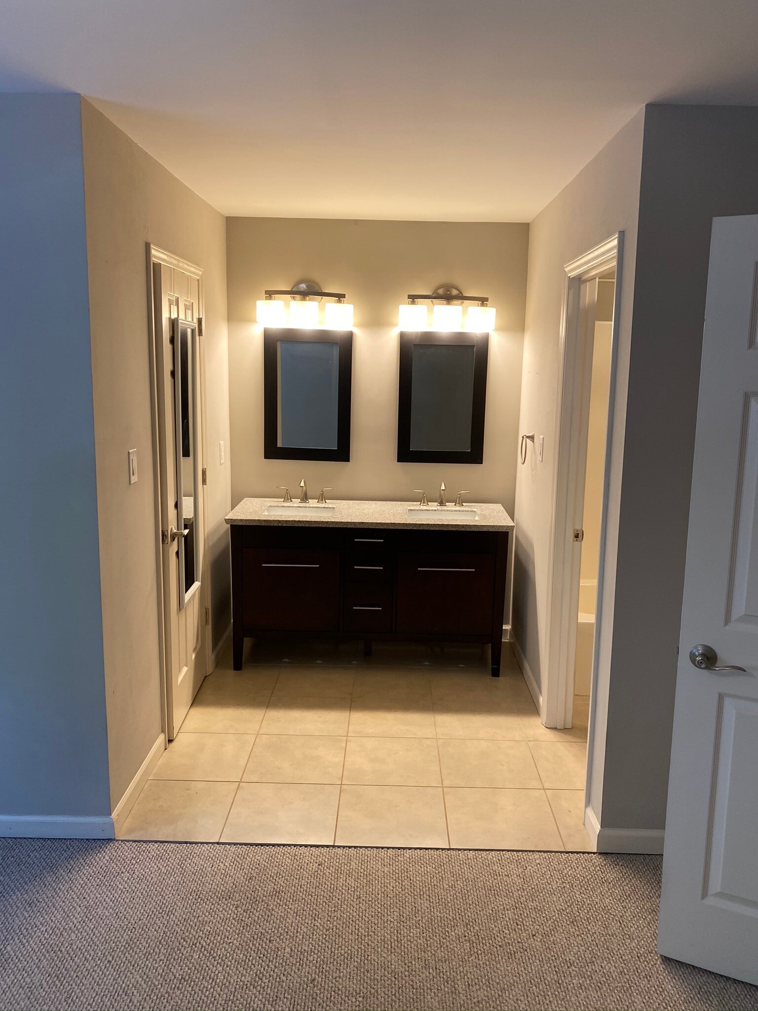 To the left, the walk-in closet. To the right, the toilet/shower/tub. - 1627 10th St Pl NW