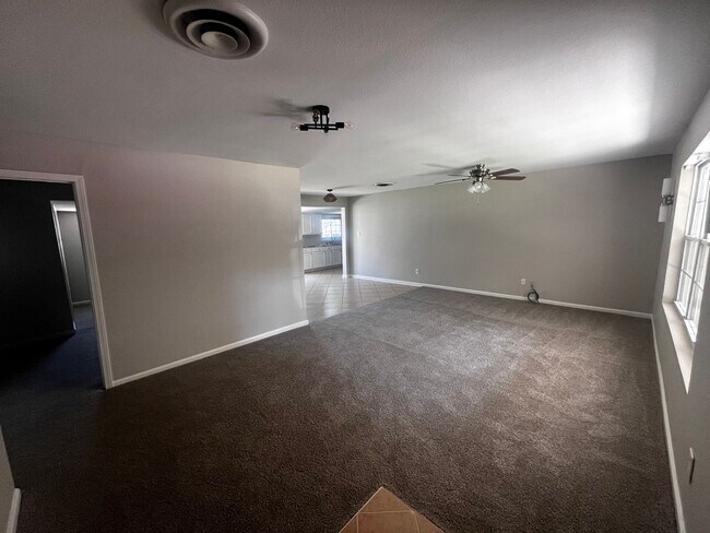 Building Photo - Freshly updated home with privacy fence in...