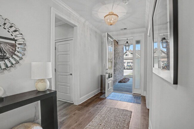 Building Photo - 3 BED | 3.5 BATHS | TWO CAR GARAGE | HERB RIVER | FURNISHED TOWNHOME