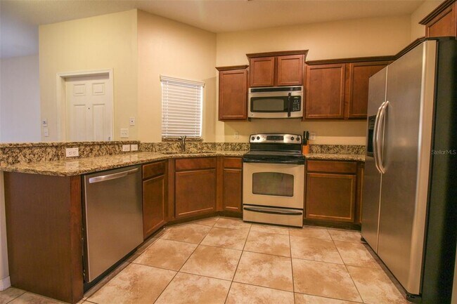 Building Photo - 4125 Shadetree Ln