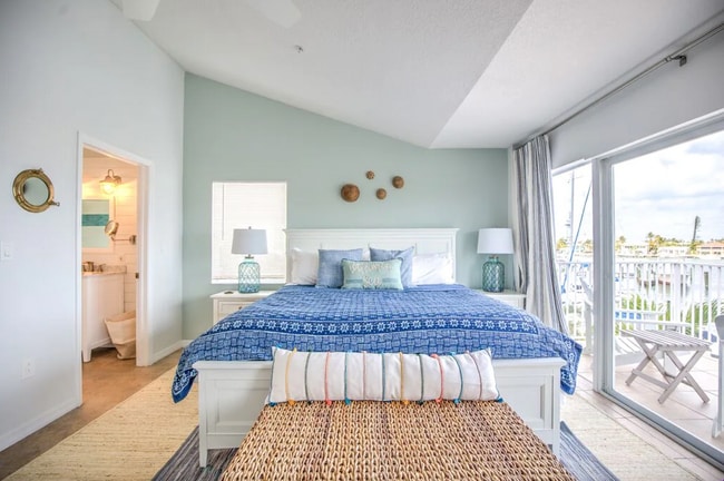 Not shown directly across from bed is a 8 drawer dresser and television with cable - 96 Ave C