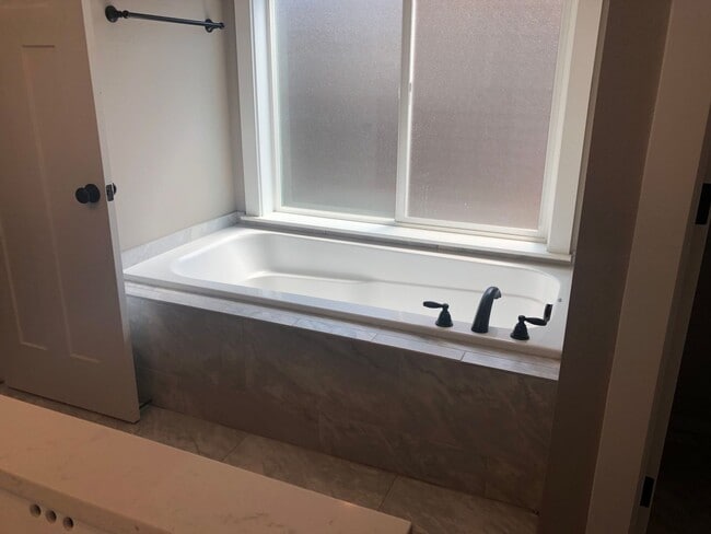 Building Photo - Beautiful New Home with Garage and Yard! A...