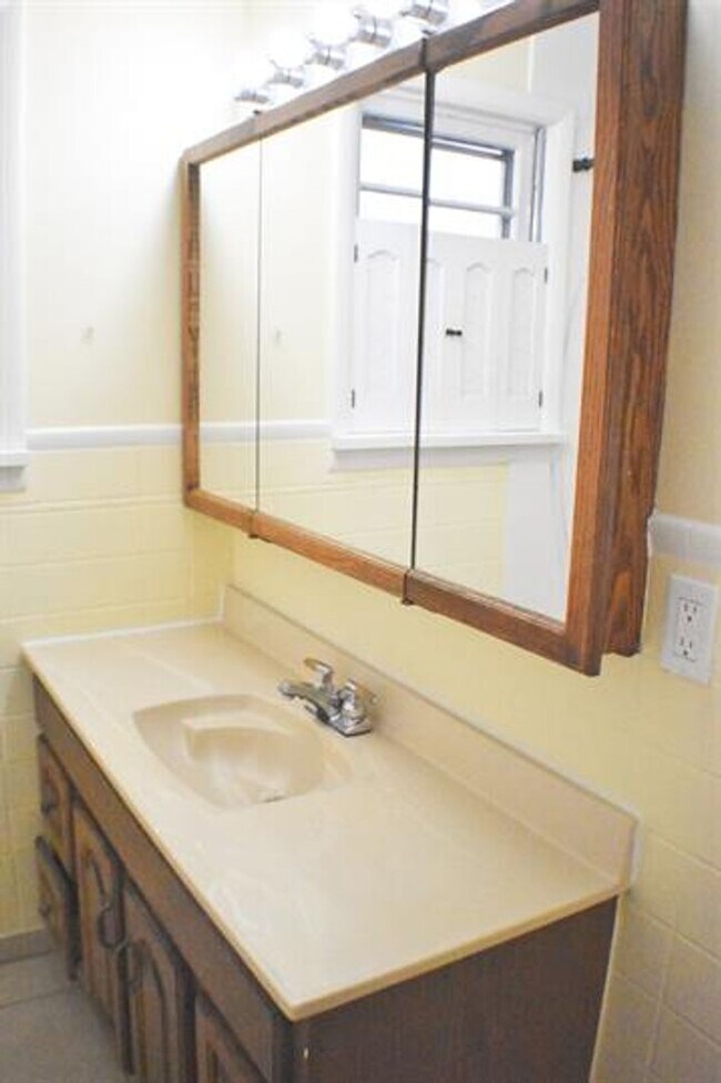 Building Photo - Updated house with original hardwoods and 2-car garage!