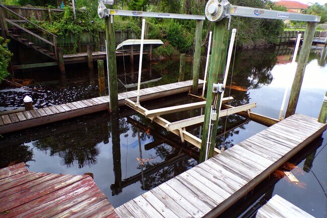 Building Photo - Live the Gulf Breeze Waterfront Life – Dock, Canal Access & Boat Lift!