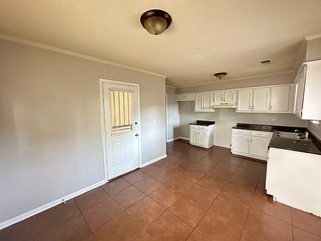 Building Photo - MOVE-IN READY! 3BR/2BA in Quiet Cove | Brick Fireplace | Fenced Yard & Patio!