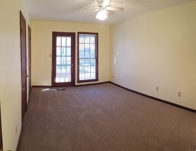 Primary bedroom with balcony access - 114 Colonial Ct