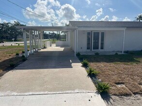 Building Photo - "Charming 2-Bed Retreat Waterfront W/Pool ...