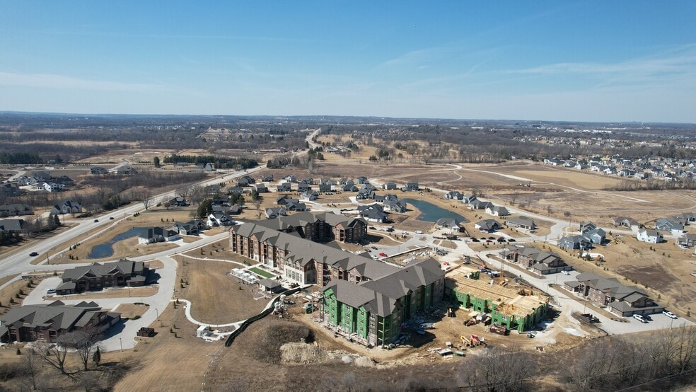 Birds-eye view of the Highlands of Aero Park and surrounding residential neighborhood. - Highlands at Aero Park Apartments & Townhomes 55+