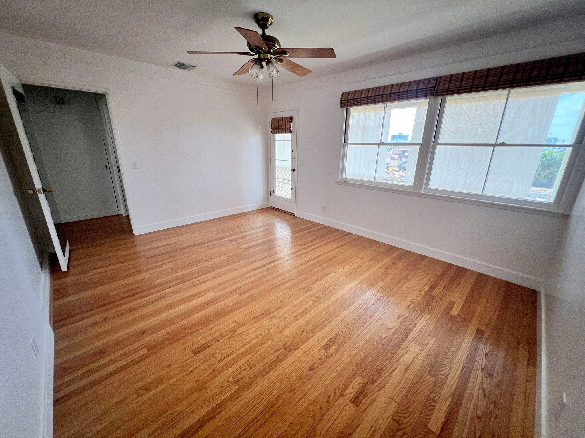 Bedroom with lots of natural light, private back balcony. - 1327 N Central Ave