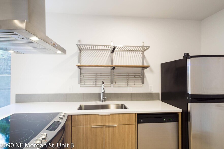 Kitchen features stainless steel appliances, refrigerator and dishwasher. - 2090 NE Morgan St