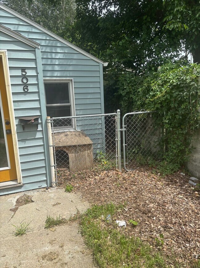 Building Photo - Perfect Home for You and Your Pup! Dog House Included + Fenced Yard