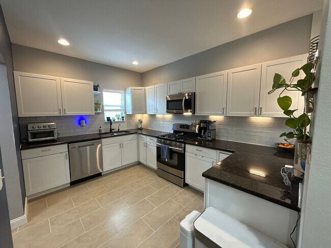 Building Photo - *COMING SOON* Updated Home Near Downtown – EV Charger, Office & Outdoor Oasis!