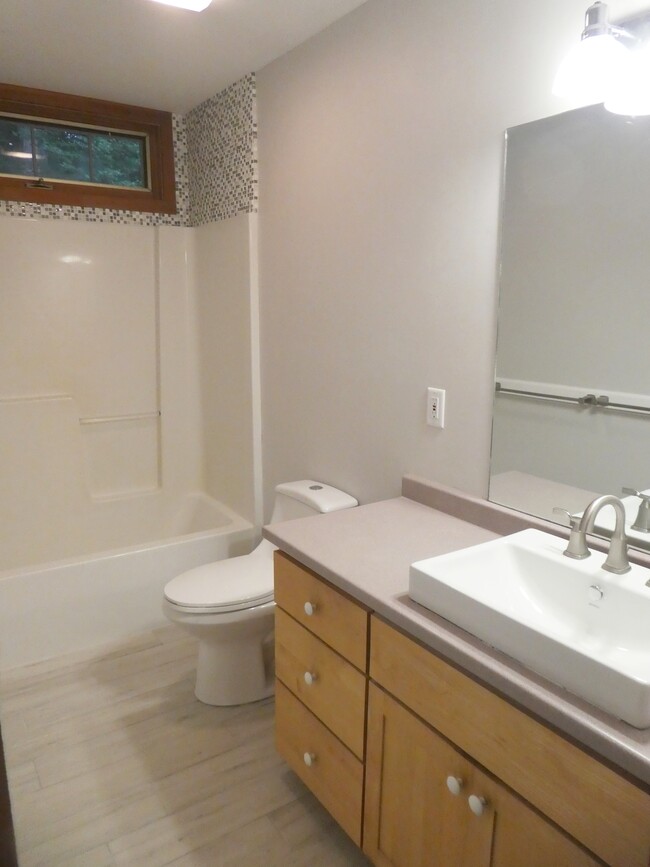 bathroom with tub/shower combo, vanity storage - 274 Bruning Rd