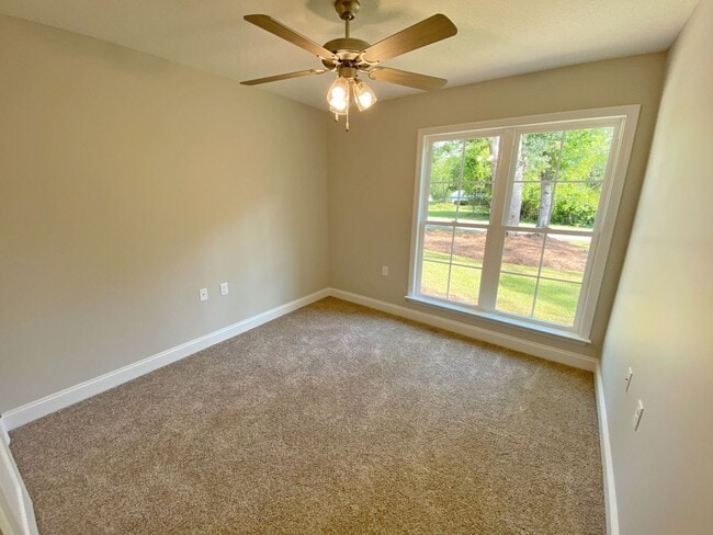 Building Photo - $500 Move-in Discount! Modern 4-Bedroom Home with Fenced Yard Near Moody AFB