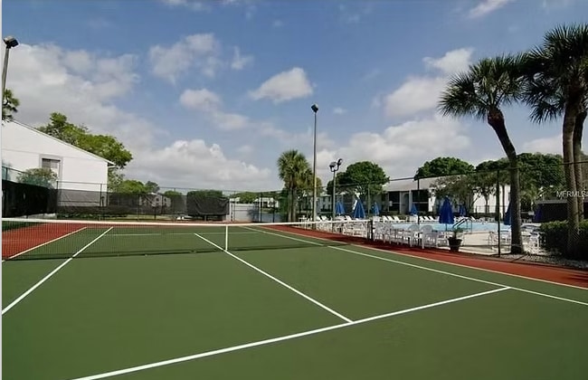 Tennis court next to pool - 1353 Pine Ridge Cir E