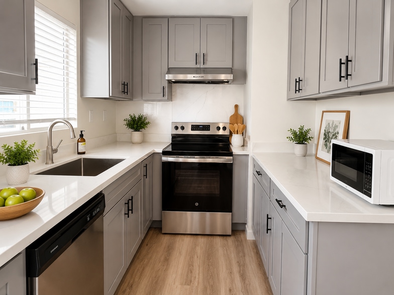 Modern kitchen with sleek quartz counters, stainless steel appliances, and ample storage. - 2614 Warring Street