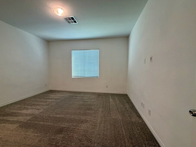 Building Photo - GATED 3 BED 2.5 BATH TOWNHOME WITH 2-CAR GARAGE, COVERED PATIO & COMMUNITY POOL