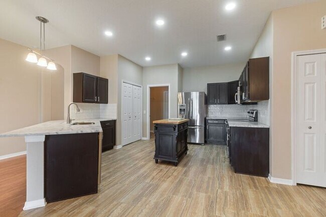 Building Photo - Executive Living Waits!