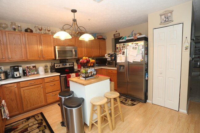 Building Photo - Available -Spacious 2 Car Garaged Townhome...