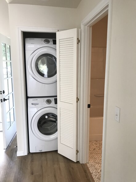 Washer and dryer beside entrance to bathroom - 224 NE Jefferson St