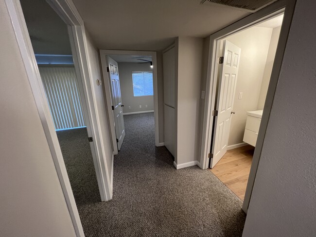 Hallway to bedrooms, bathroom and linen closet - 7602 N 61st Ave