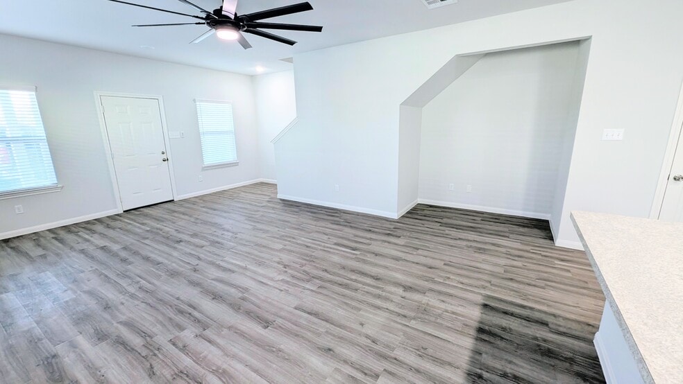 Large living area with an amazing nook that could house a reading corner, desk, or storage for toys. - 13218 HP Johnson St