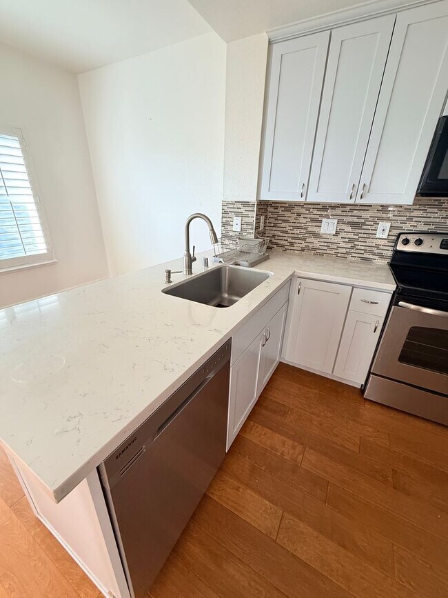 Building Photo - **Coming Soon — Spacious 3BR + 2.5BA Two-Level Condo in Pointe Pacific**