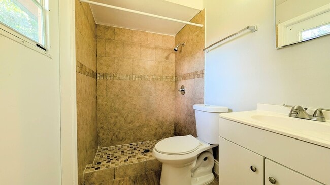 Building Photo - 2 bedroom 2 bath with an updated kitchen, bathrooms, and tile flooring throughout.