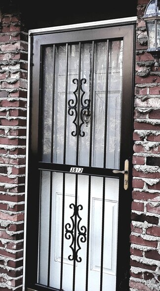 Heavy storm door on front entrance - 3830 Lebanon Church Rd