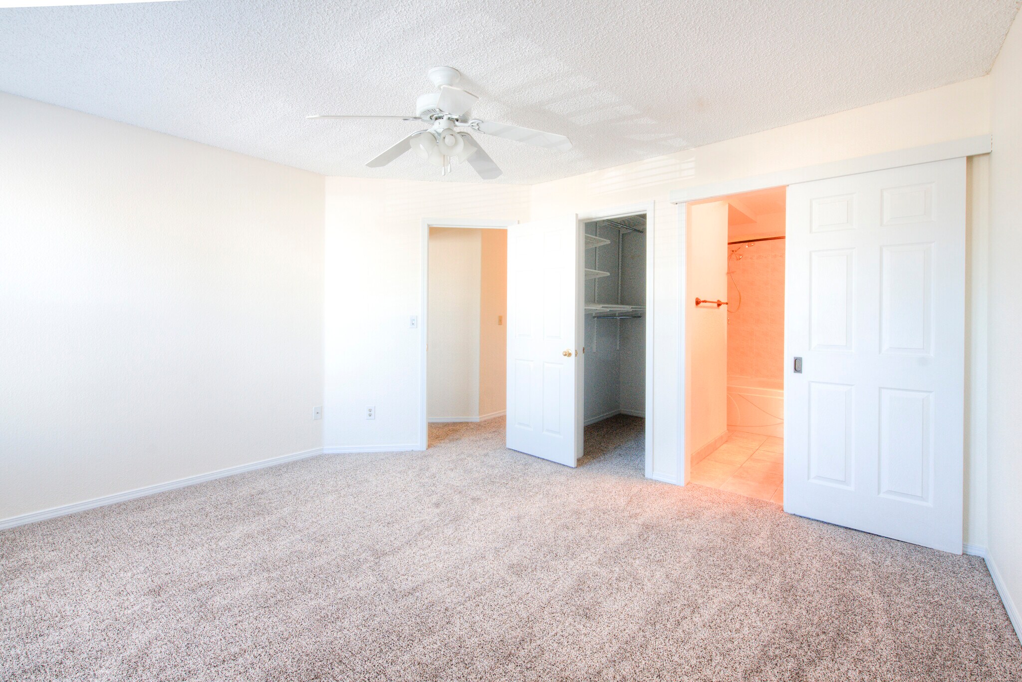 Primary bath has a barn door and a walkin closet. - 2875 Richmond Dr