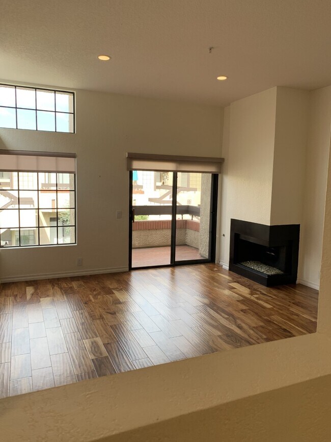 living room, balcony, fireplace facing north - 2601 S Broadmoor Dr