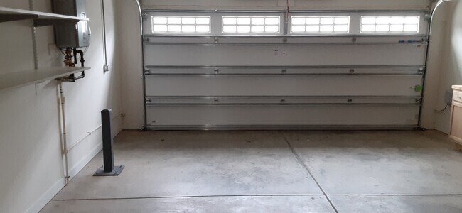 Garage wtih tankless hot water heater - 4919 Settlers Market Blvd