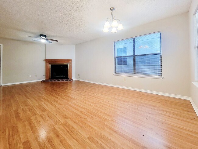 Building Photo - Warm & Inviting 4BR / 2.5BA Home with Covered Deck and 2-Car Garage