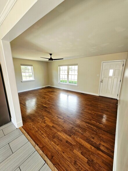 Living room with hardwoods and natural light - 4530 Bible Church Rd