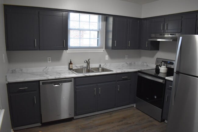 Completely updated kitchen including new countertops and sink and new Whirlpool appliances - 610 River Rouge Dr, Unit A